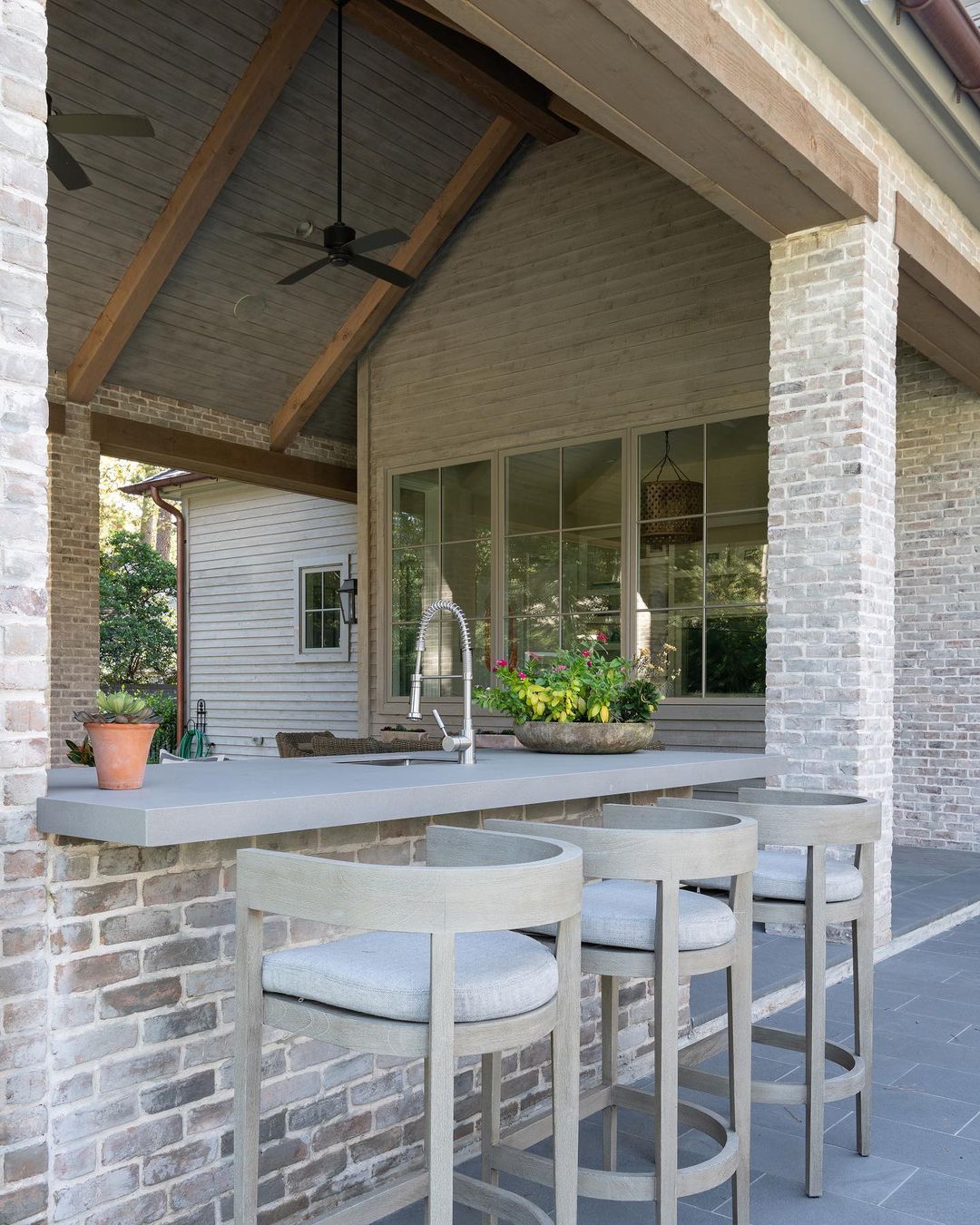 Backyard Bar Area Under an Extended Roof. Photo by Instagram user @parkerevans_custombuilders