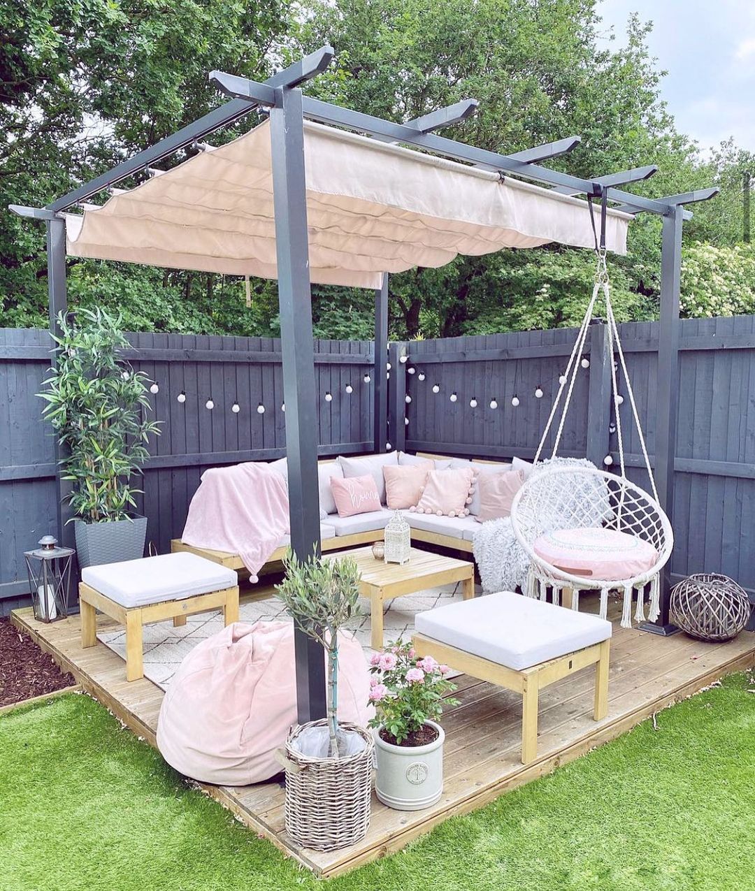 Small Backyard Corner Patio with an Outdoor Canopy Installed. Photo by Instagram user @luckyplot13