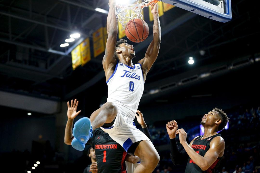 Tulsa University Basketball Player Dunking Against Houston. Photo by Instagram user @imaulephotos