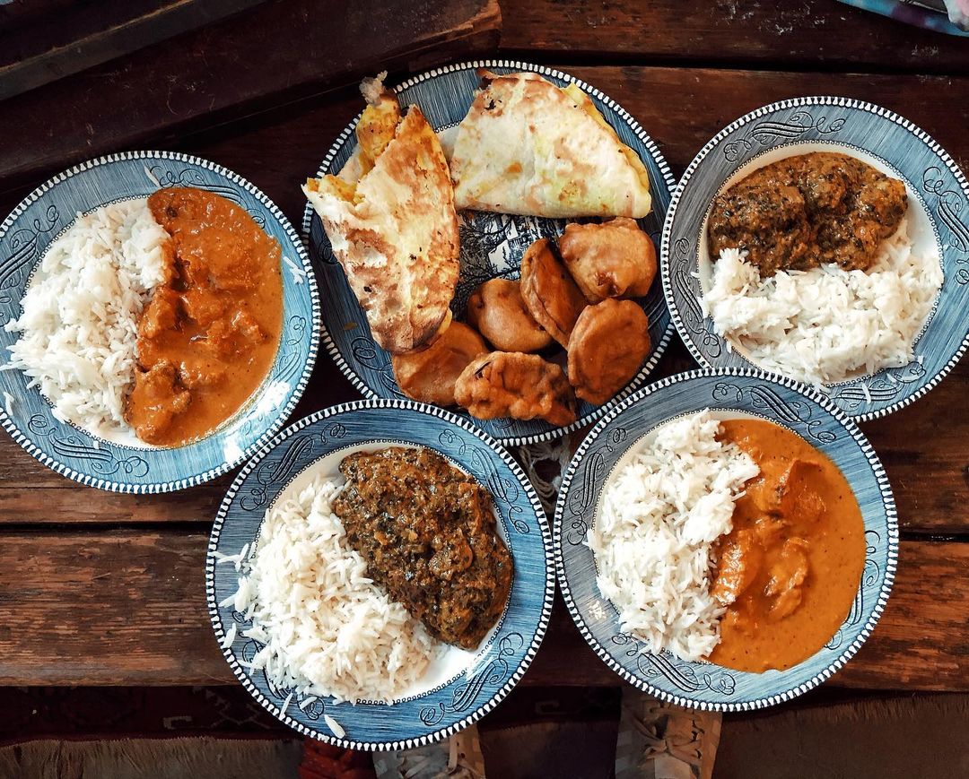 Plates of Food Set Out at the India Palace Restaurant in Tulsa, OK. Photo by Instagram user @sharon.phoods