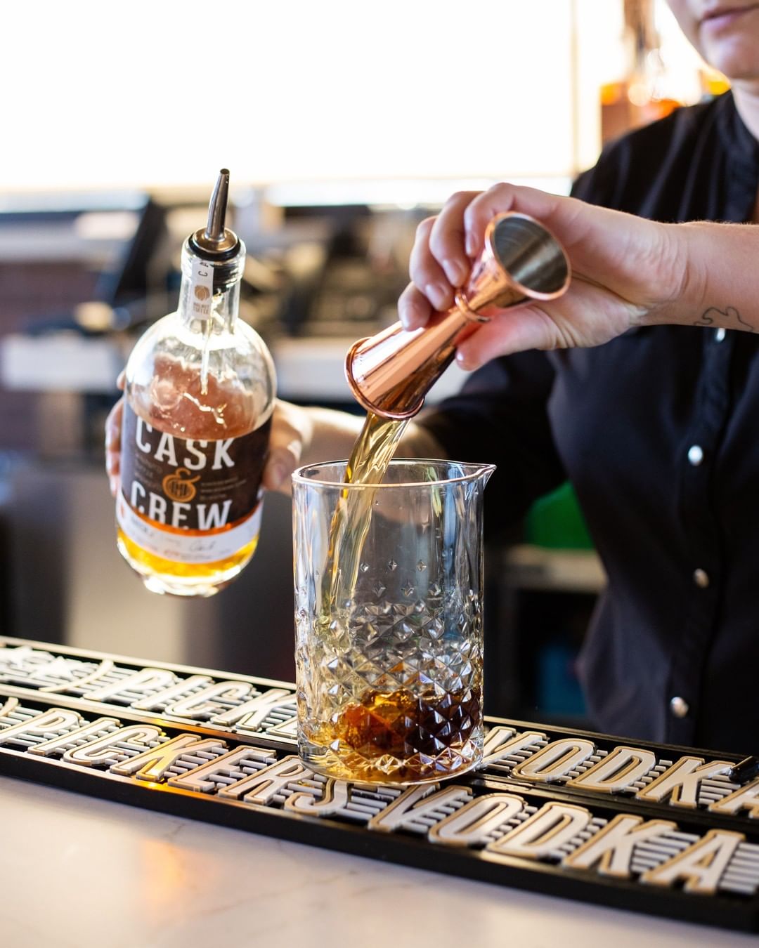 Bartender Making a Whiskey Drink at the Roof Sixty-Six Bar in Tulsa, OK. Photo by Instagram user @roofsixtysixbar