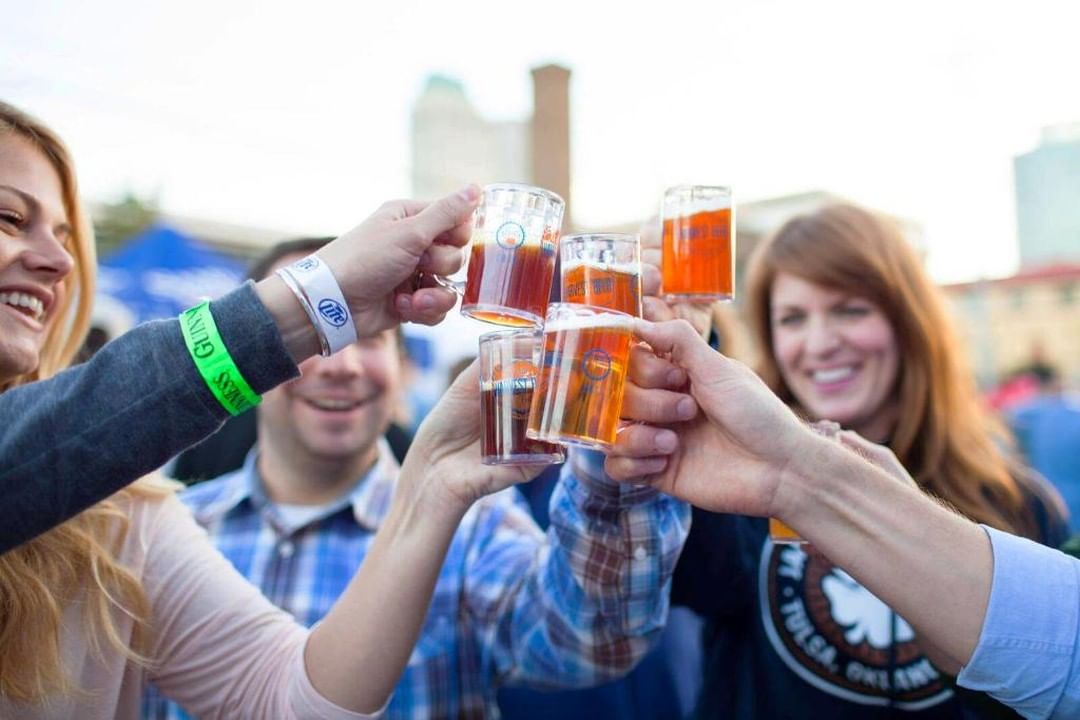 People Cheersing Mini Mugs at the Harvest Beer Festival in Tulsa. Photo by Instagram user @mcnellies_pub