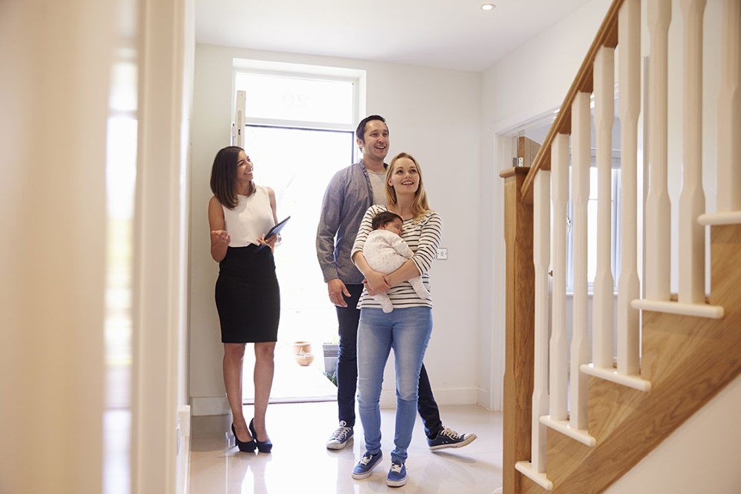 Family with baby touring a home with their real estate agent. Photo by Instagram User @thomasharveyestateagents
