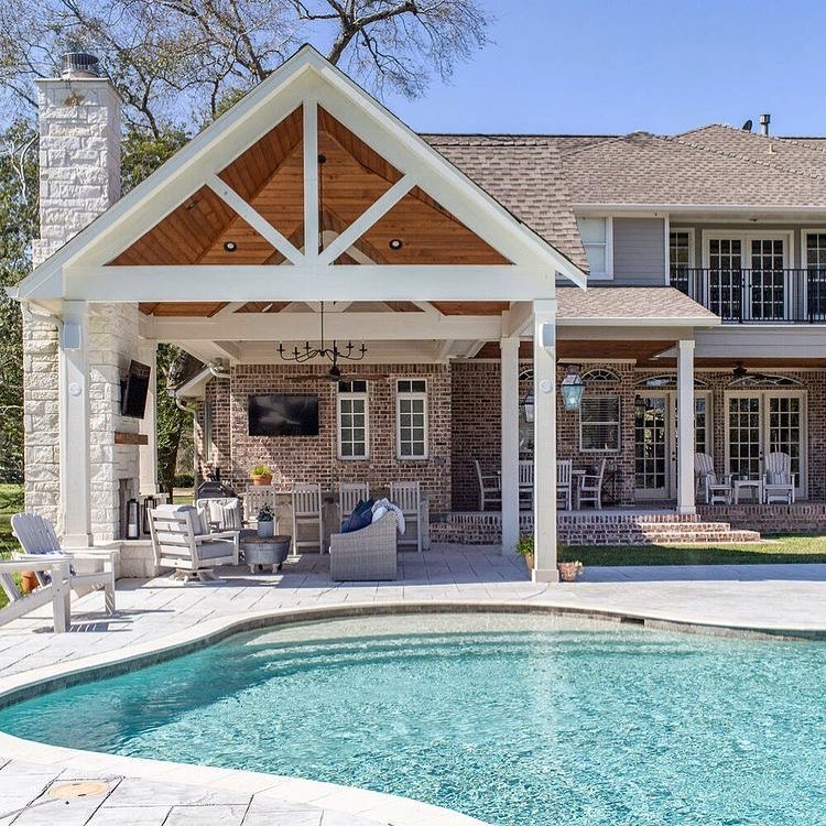 Outdoor pool and covered patio at a home in Austin, TX. Photo by Instagram User @austinrealestateguide
