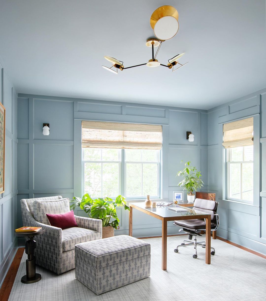 Light blue home office with great lighting and cozy seating. Photo by Instagram User @margaret.wright