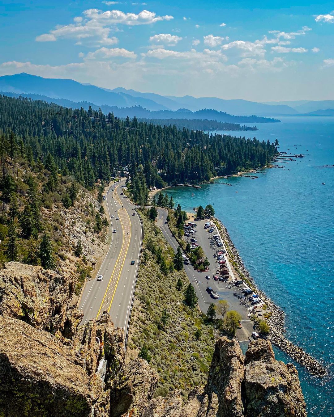 View of the Highway Going Along Lake Tahoe in South Lake Tahoe, CA. Photo by Instagram user @heyloslos
