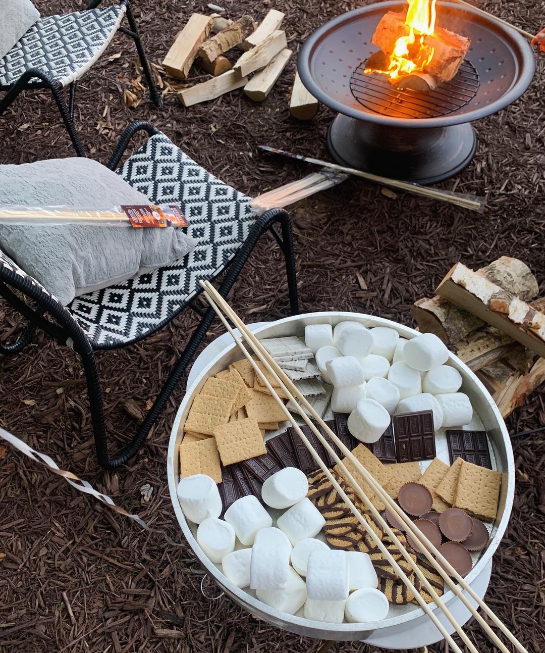 S'Mores Bar Next to a Fire Pit in a Backyard. Photo by Instagram user @marymdunn