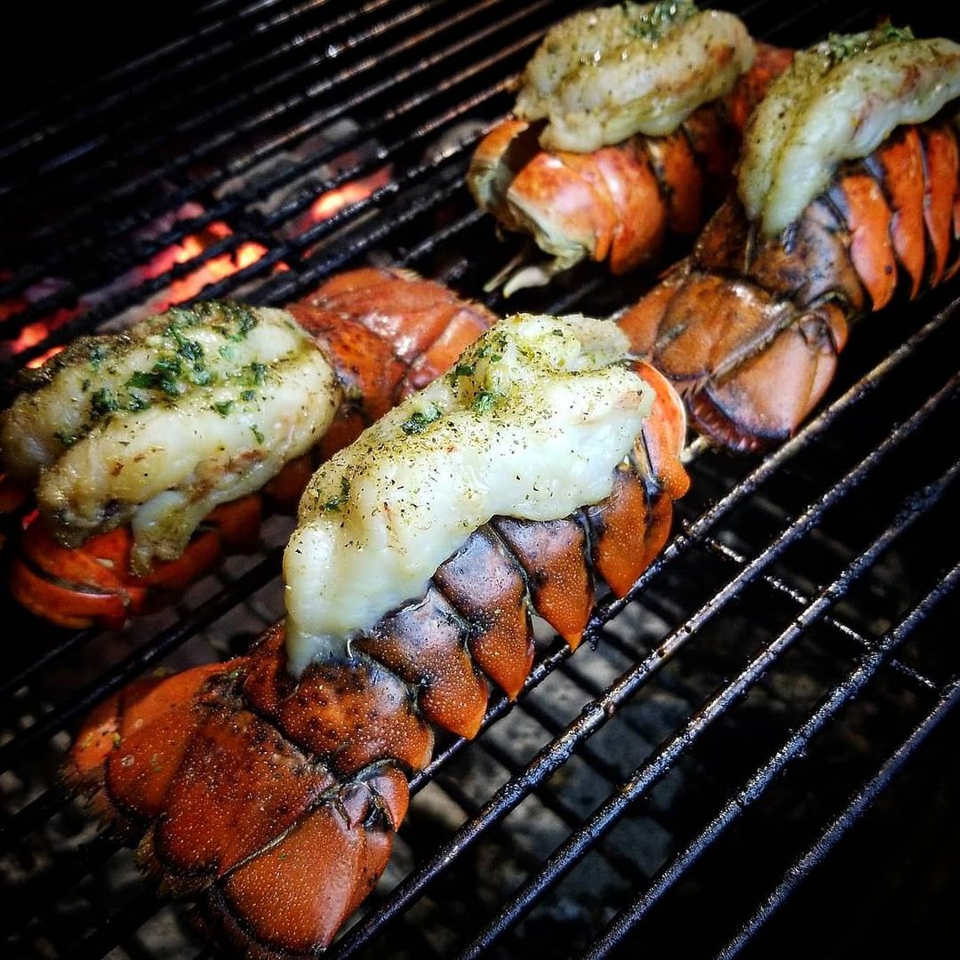 Lobster Tails on a Grill. Photo by Instagram user @bigteebackyardbbq