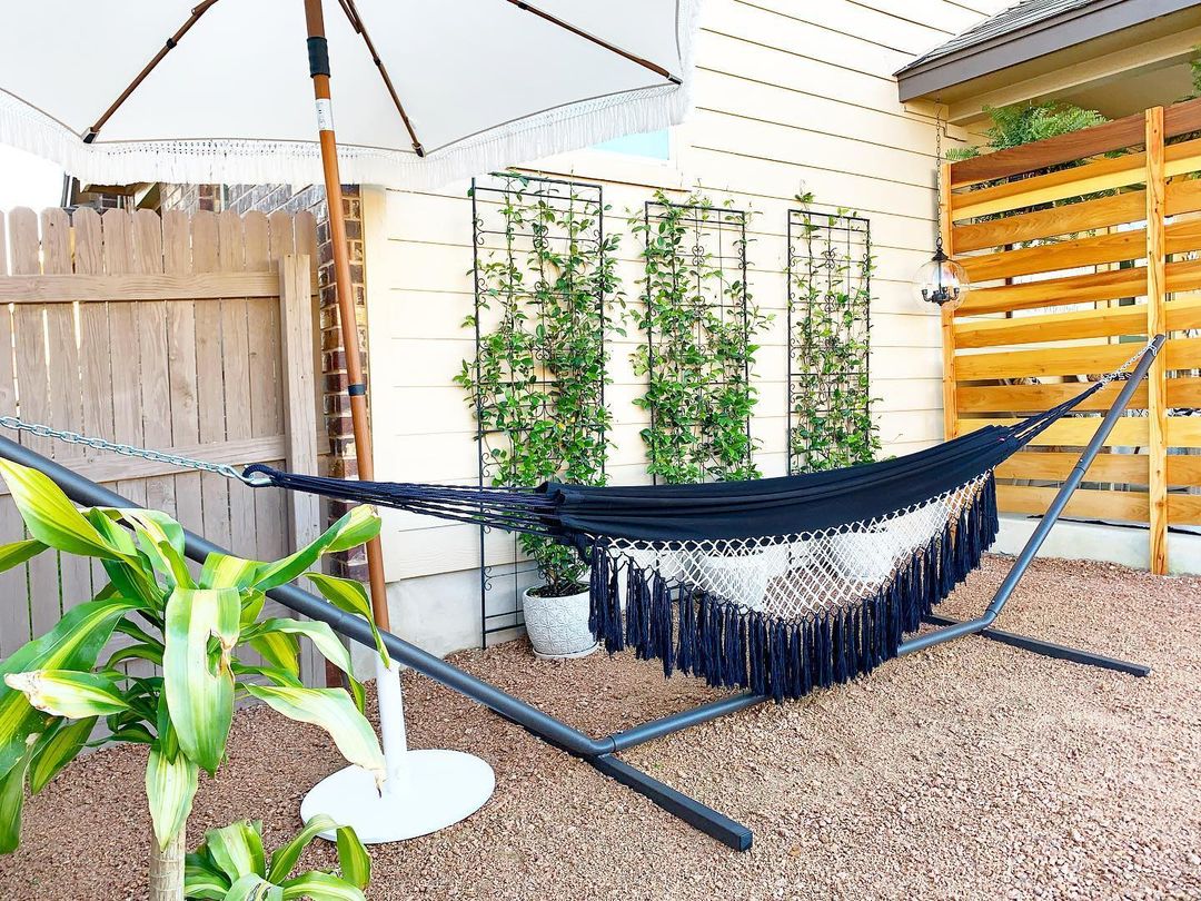 Black Hammock Set Out in a Backyard. Photo by Instagram user @ourhavenfarmhouse