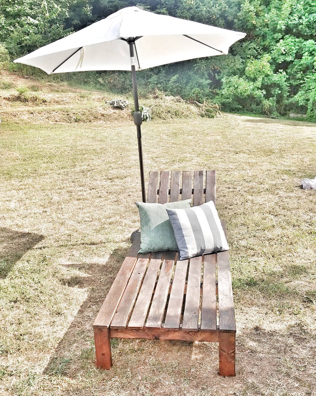 Homemade Wooden Lounger with an Umbrella. Photo by Instagram user @kelli_rae_smith