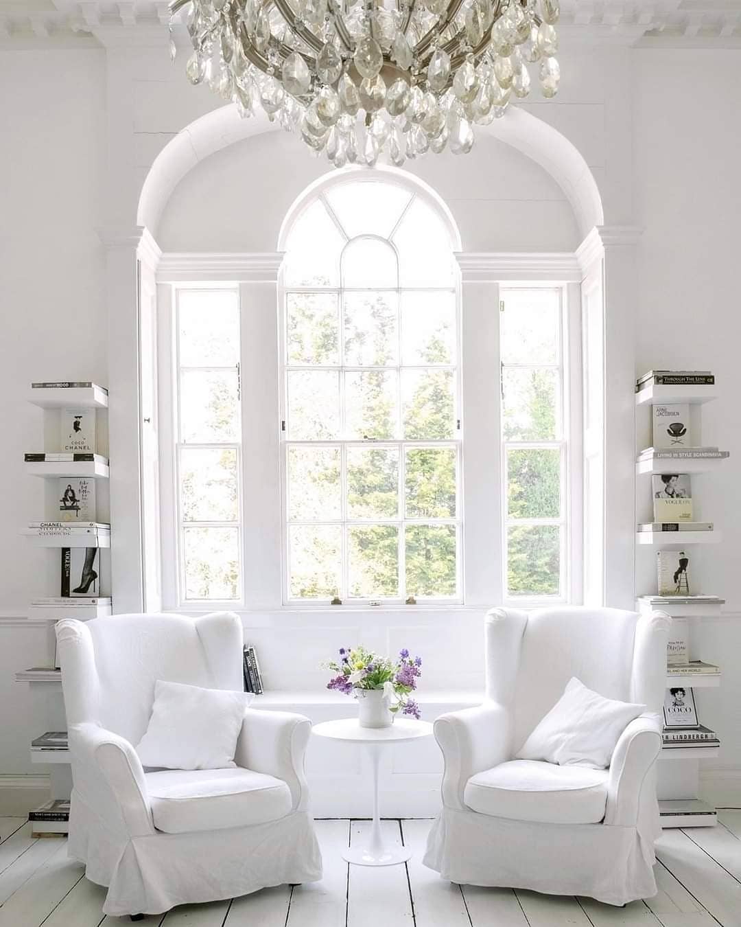 Sitting Room with Large Window letting in Light. Photo by Instagram user @dinoparrella