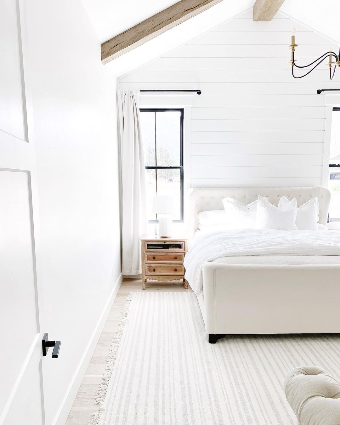 Farmhouse Style Bedroom with White, Shiplap Wall. Photo by Instagram user @our_sweet_haven
