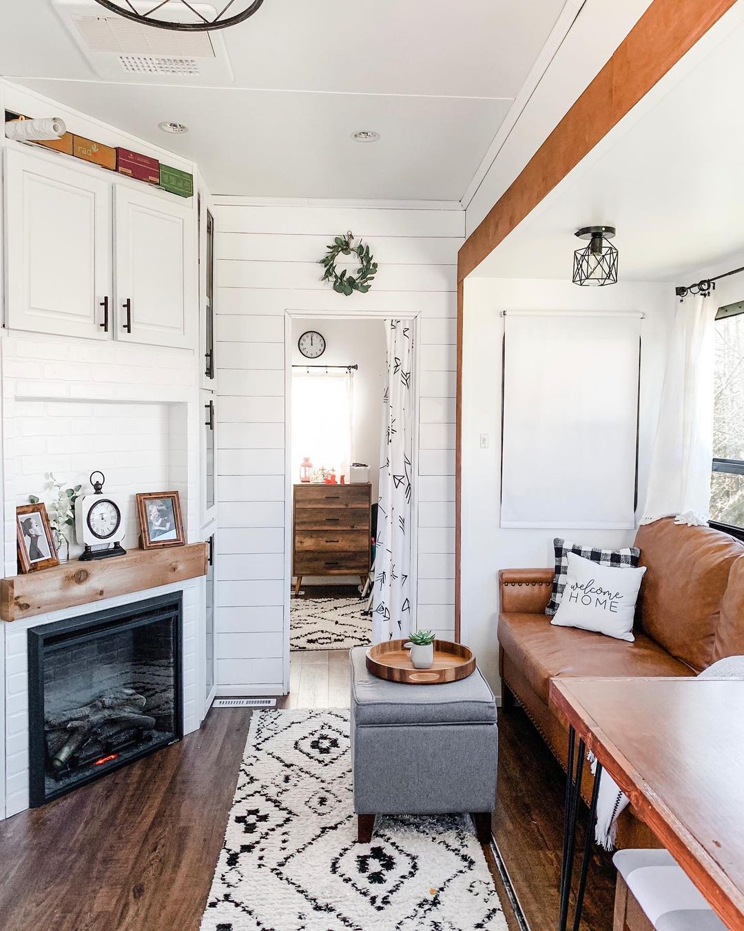 RV interior featuring a fireplace. Photo by Instagram user @thetravelingcouches.