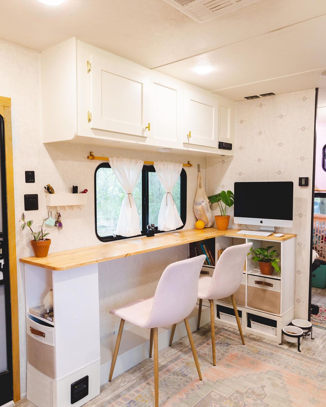 RV living/dining/and work area, a space used for multiple purposes. Photo by Instagram user @wanderfulriah.