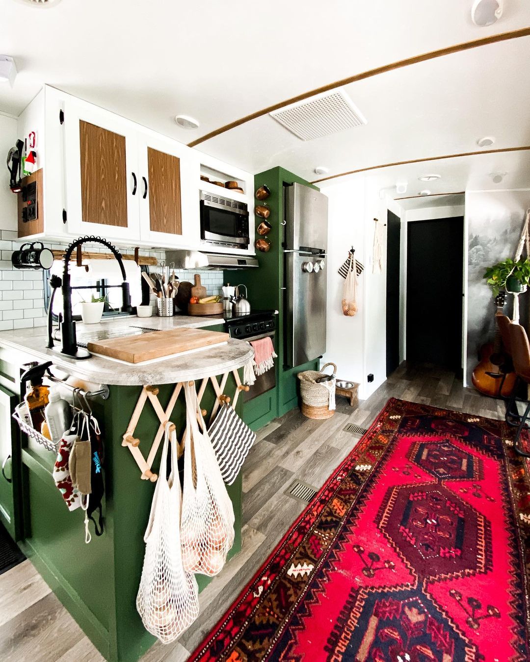 RV kitchen with wall hooks. Photo by Instagram user @place_ofmy_taste.