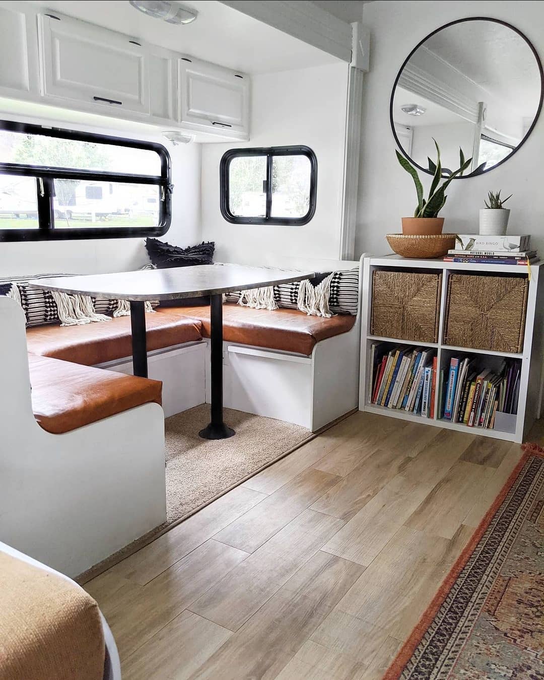 RV dining area featuring storage opportunities under the benches. Photo by Instagram user @thedekkertrekkers.