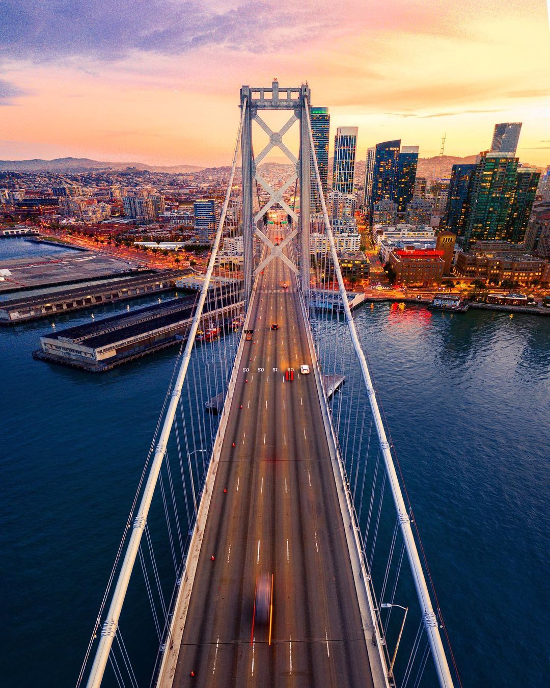 View of the Bay Bridge in San Francisco, CA at Dusk. Photo by Instagram user @bersonphotos