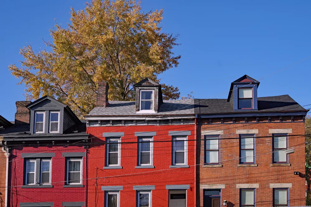 Old brick rowhouses painted in charming colors in Pittsburgh