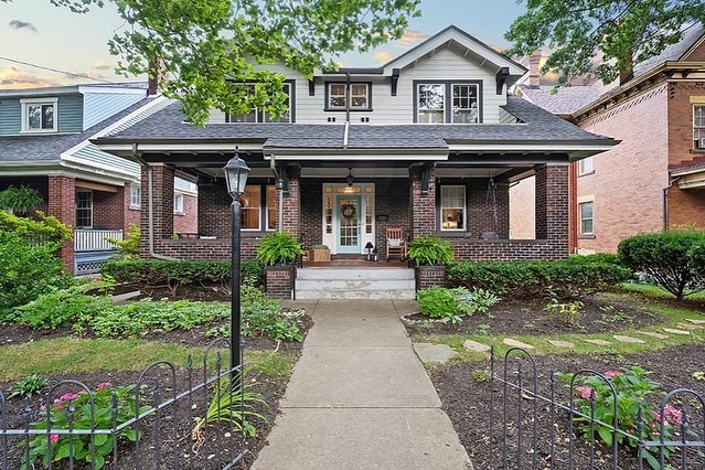 Rustic brick home with a large front porch and light pole in Regent Square. Photo from Instagram user @themollyfinley