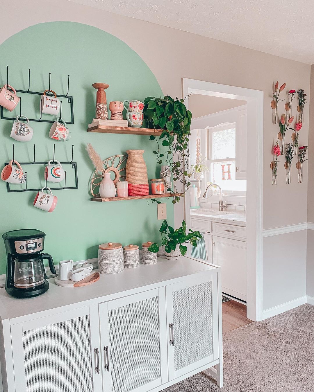 White Hutch with White Kitchenware on the Wall that's Painted Blue. Photo by Instagram user @living_with_kay