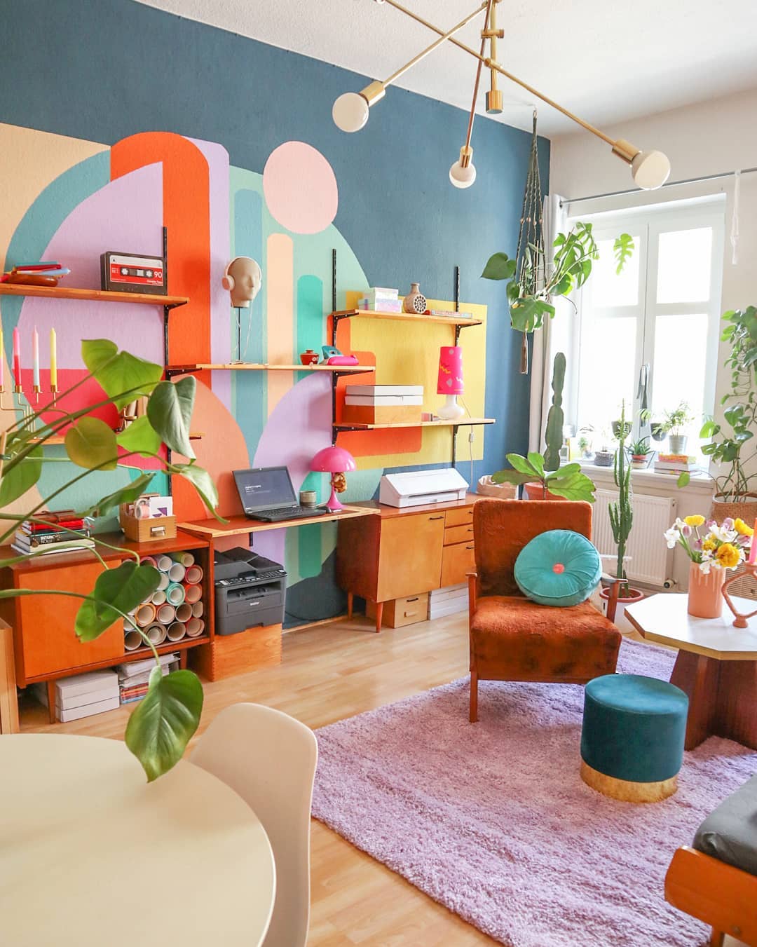 Office Space with Bright Mural on the Wall. Photo by Instagram user @___duundich__