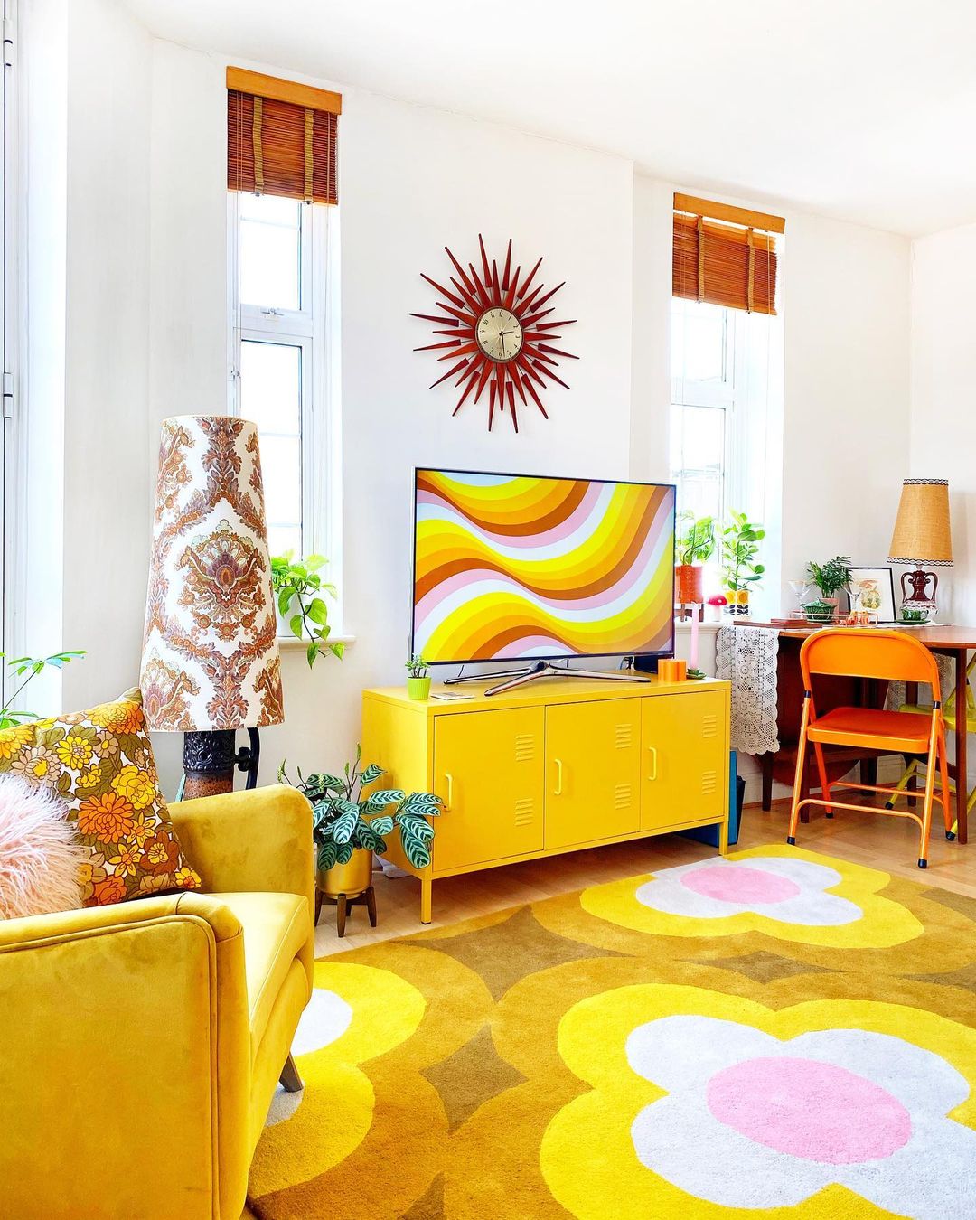 White Room with Yellow Accents and Bright Area Rug. Photo by Instagram user @theretroflat