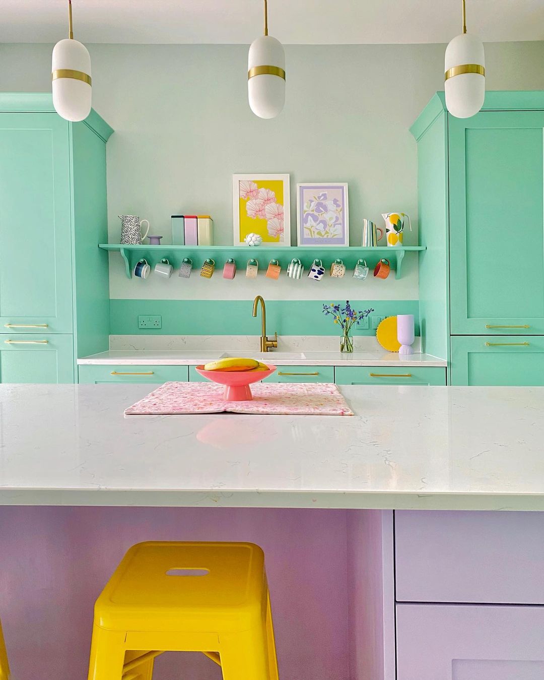 Brightly Painted Kitchen Cabinets and Island. Photo by Instagram user @paintthetownpastel