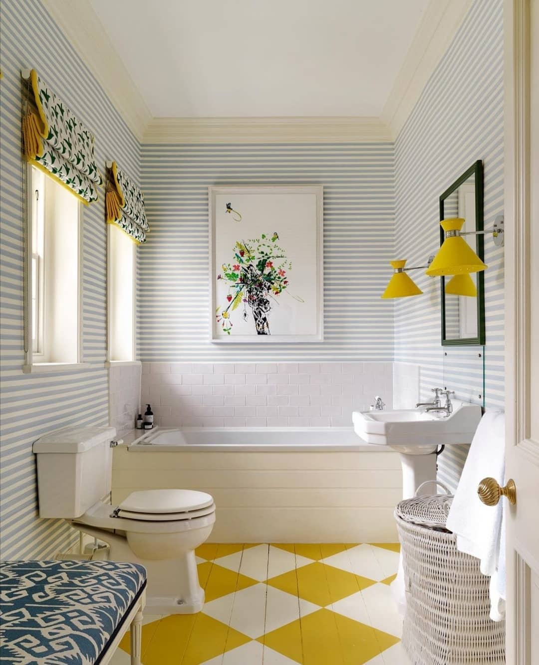 Updated Bathroom With Striped Wallpaper and White and Yellow Diamond Flooring. Photo by Instagram user @countryfurnishings