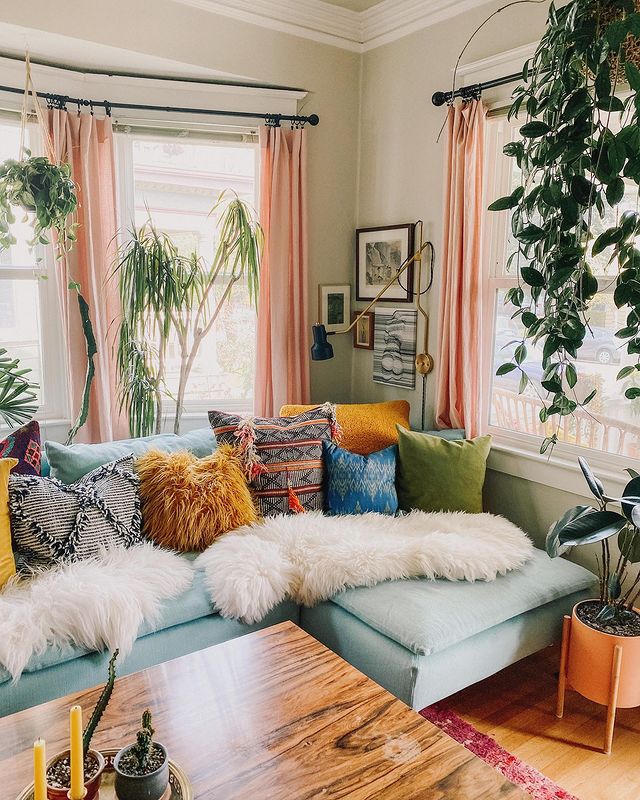 Living Room with Blue Couch and Colorful Throw Pillows. Photo by Instagram user @marytanner.creative
