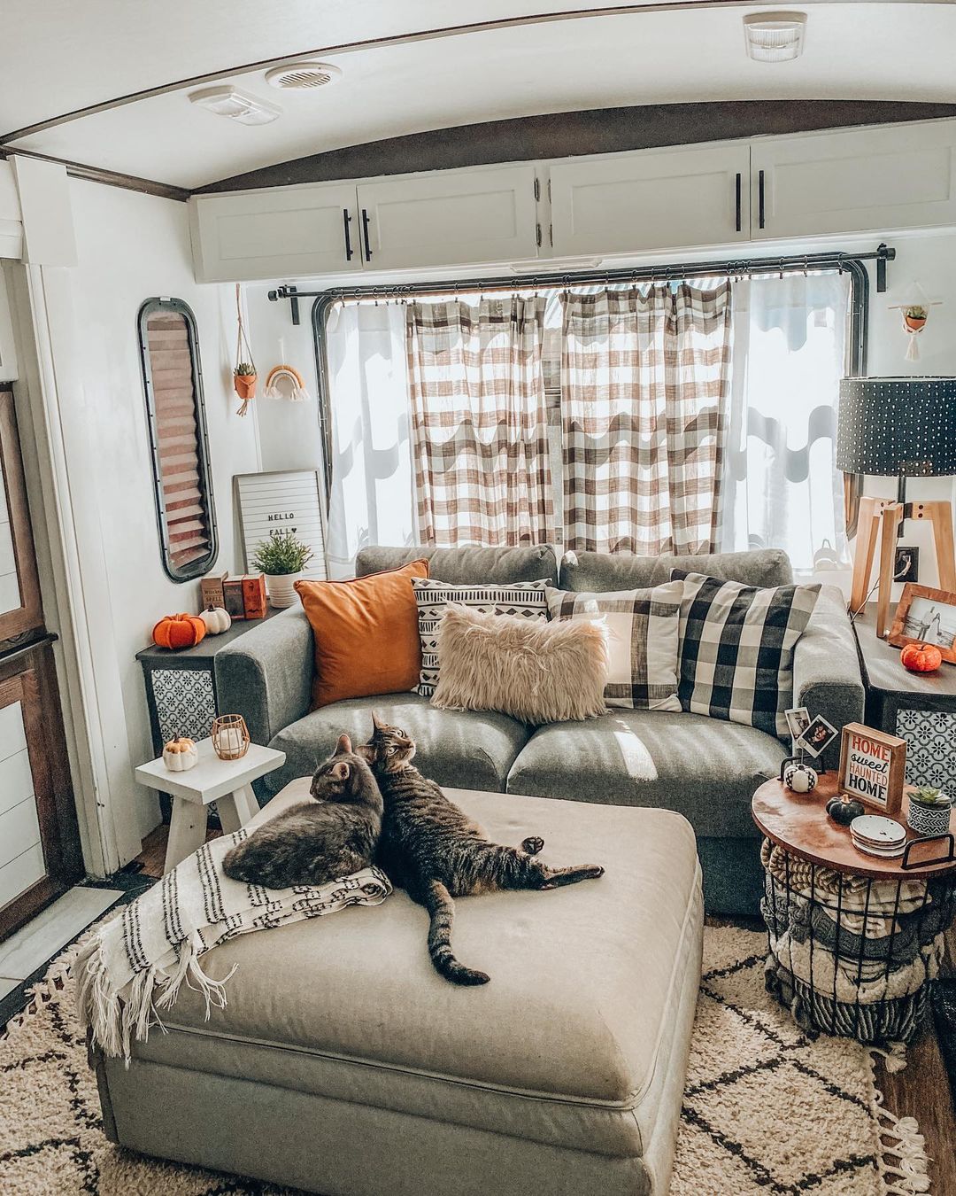 Two Cats Laying on an Ottoman in an Updated RV. Photo by Instagram user @simplecatlady