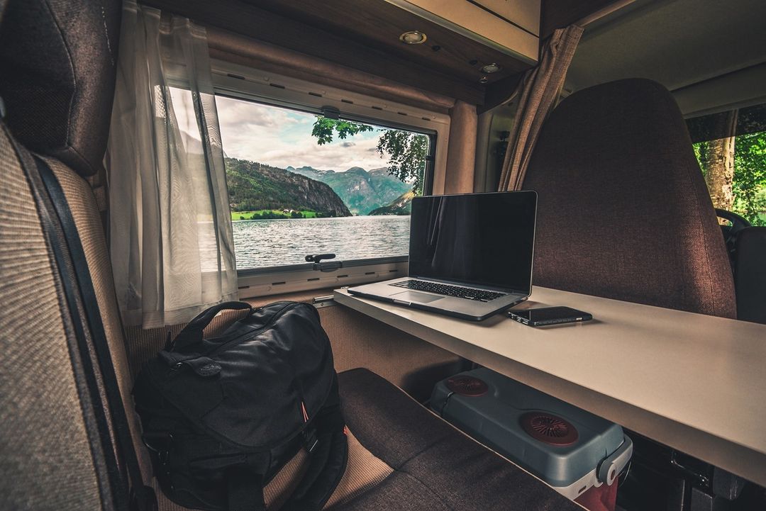 Laptop and work bag showing that you can work from your RV. Photo by Instagram User @togo_rv