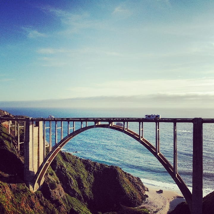 RV driving across scenic Bixby Bridge in California. Photo by Instagram User @adventureness
