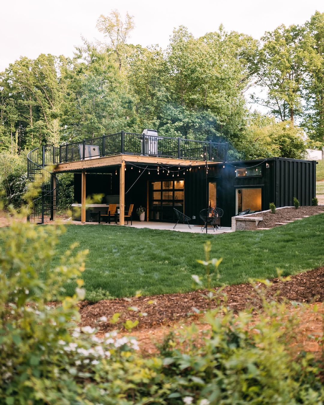 Large shipping container house with a big balcony and porch. Photo by instagram user @levimkelly