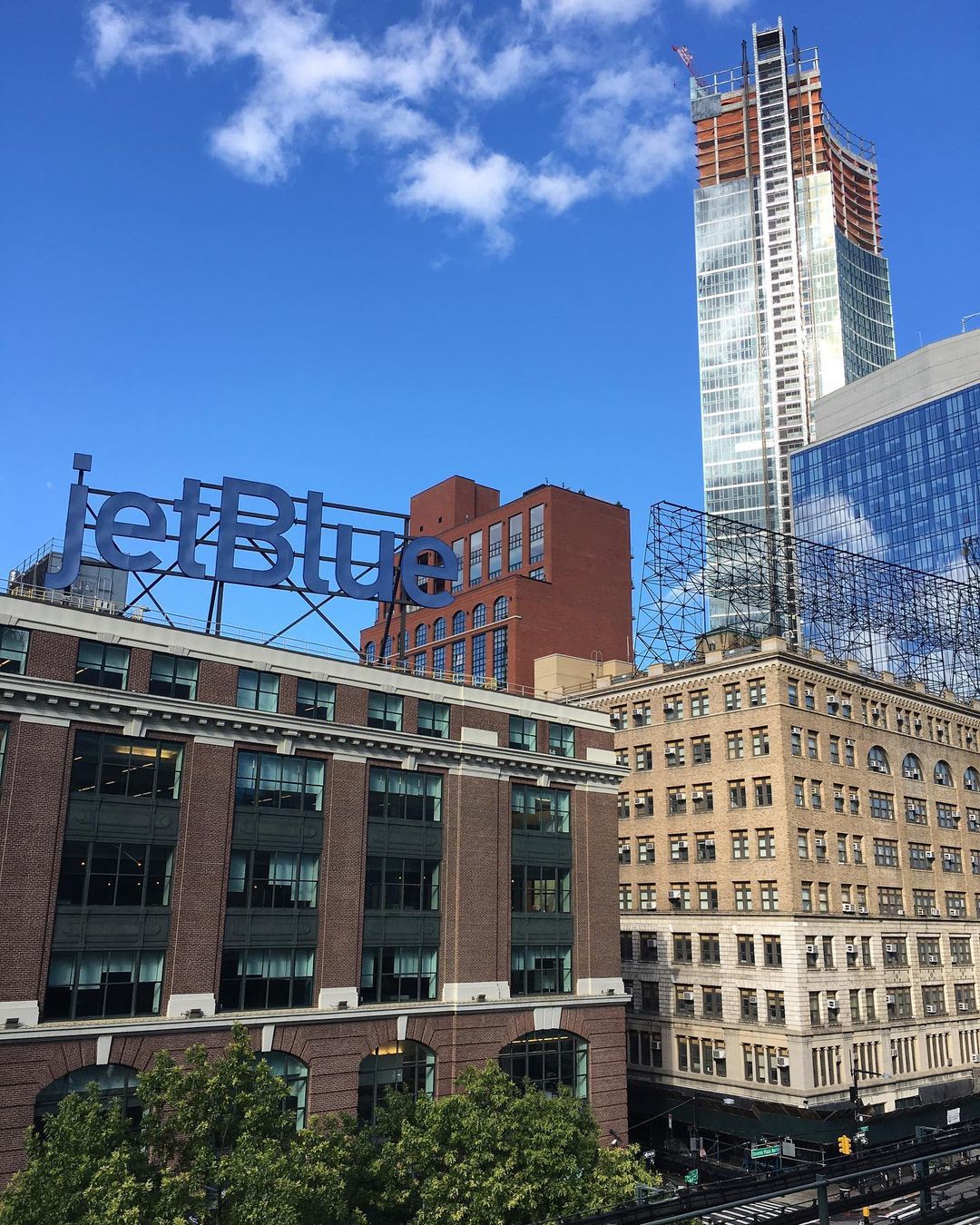 Jet Blue Headquarters sign in Queens Plaza photo by Instagram user @mgamarritas