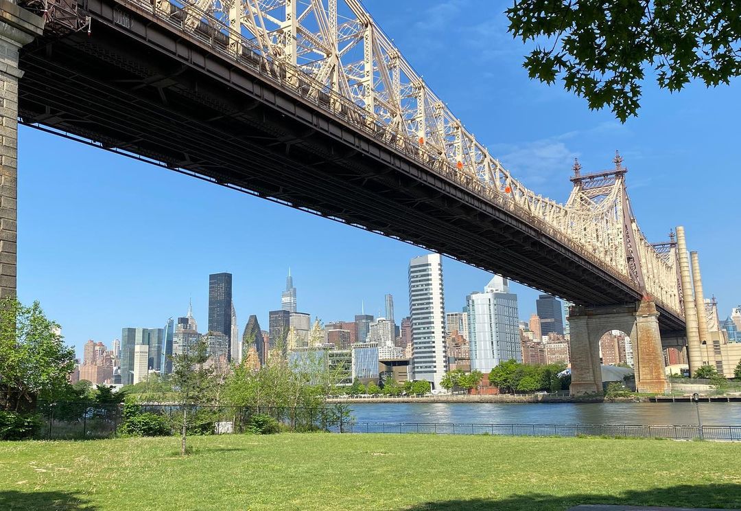 Queensboro Bridge over a park photo by instagram user @genebryantwalkinginnewyork