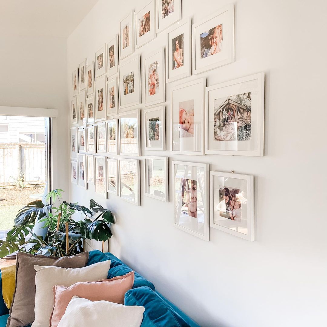 Living Room with Nice Gallery Wall Above Couch. Photo by Instagram user @home.at.wainui