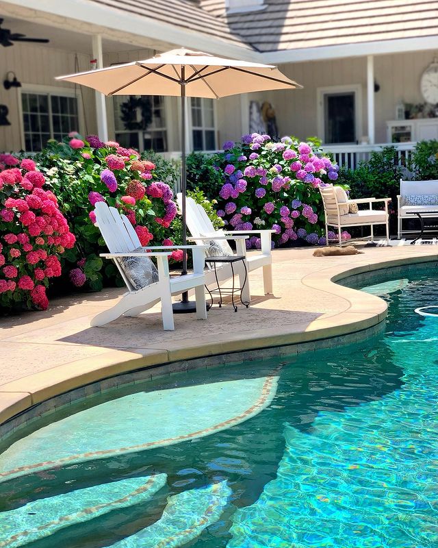 Backyard Pool with White Adirondack Chairs. Photo by Instagram user @homehydrangea