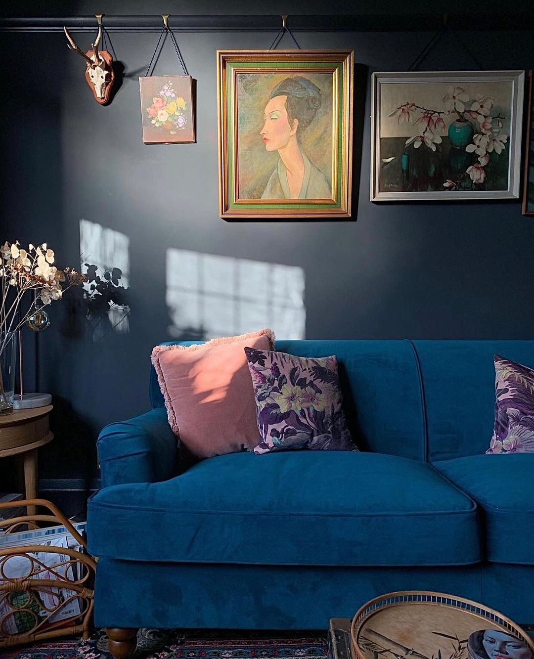Blue Sitting Room with Art Hung on the Wall. Photo by Instagram user @solidandpattern