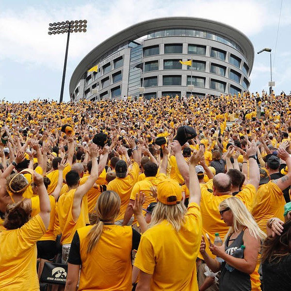 Iowa Fans Waving to the Children's Hospital during an Iowa Football Game. Photo by Instagram user @thesummitic_
