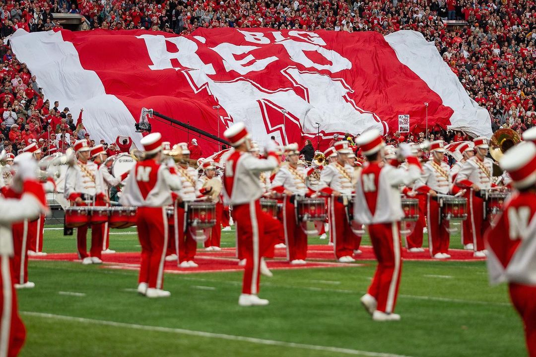 Big Red Band Playing on the Field at Memorial Stadium Before a Nebraska Cornhuskers Game. Photo by Instagram users @hailvarsity & @peterson_john_s