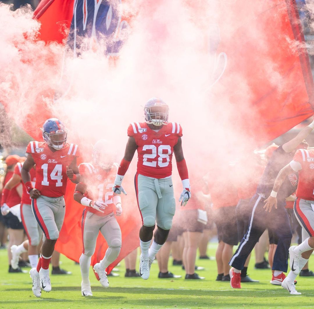 Players Running onto the Field at Vaught-Hemingway Stadium at the University of Mississippi. Photo by Instagram user @olemiss