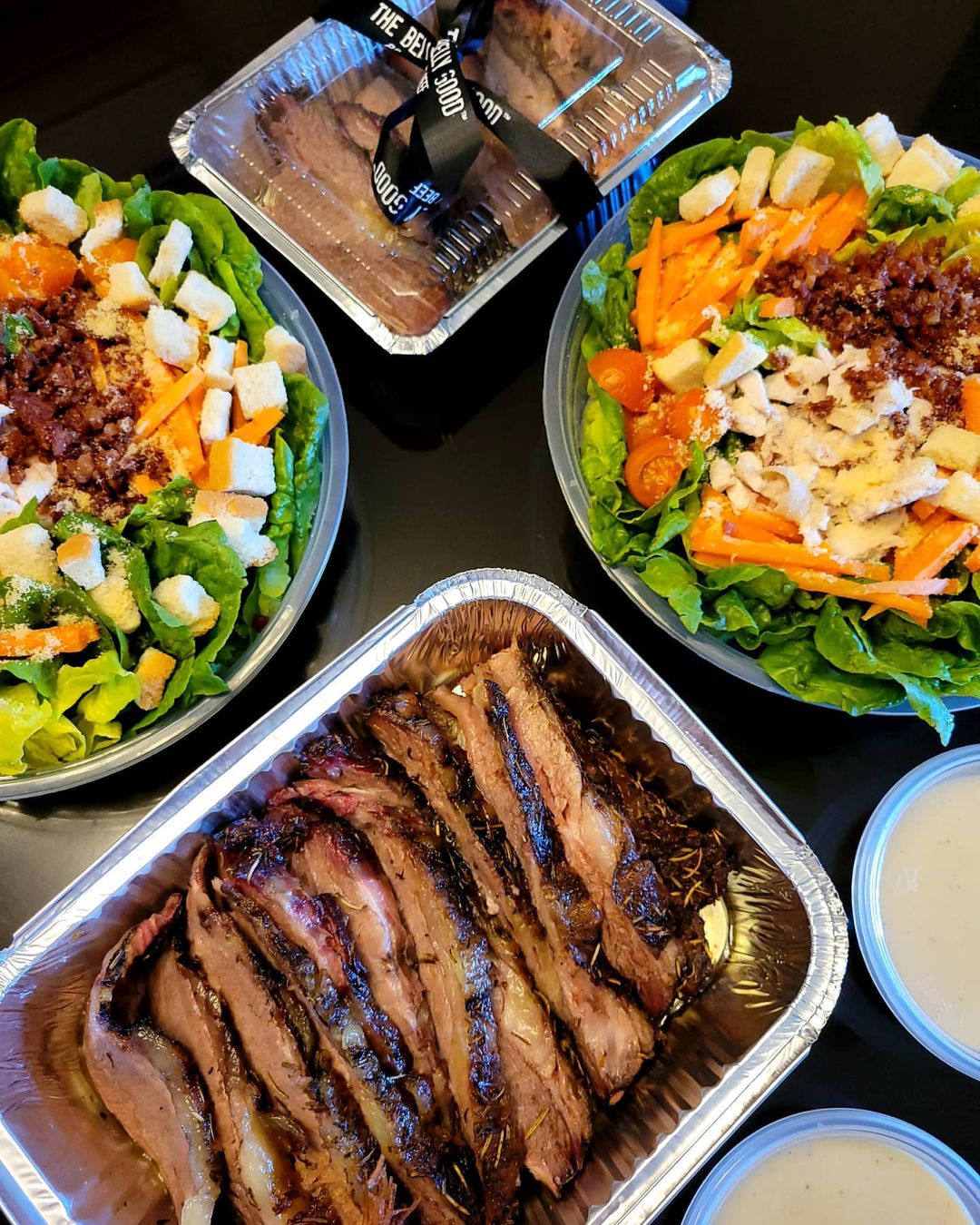 Ribs and Salads. Photo by Instagram user @thebellygoodroastbeef