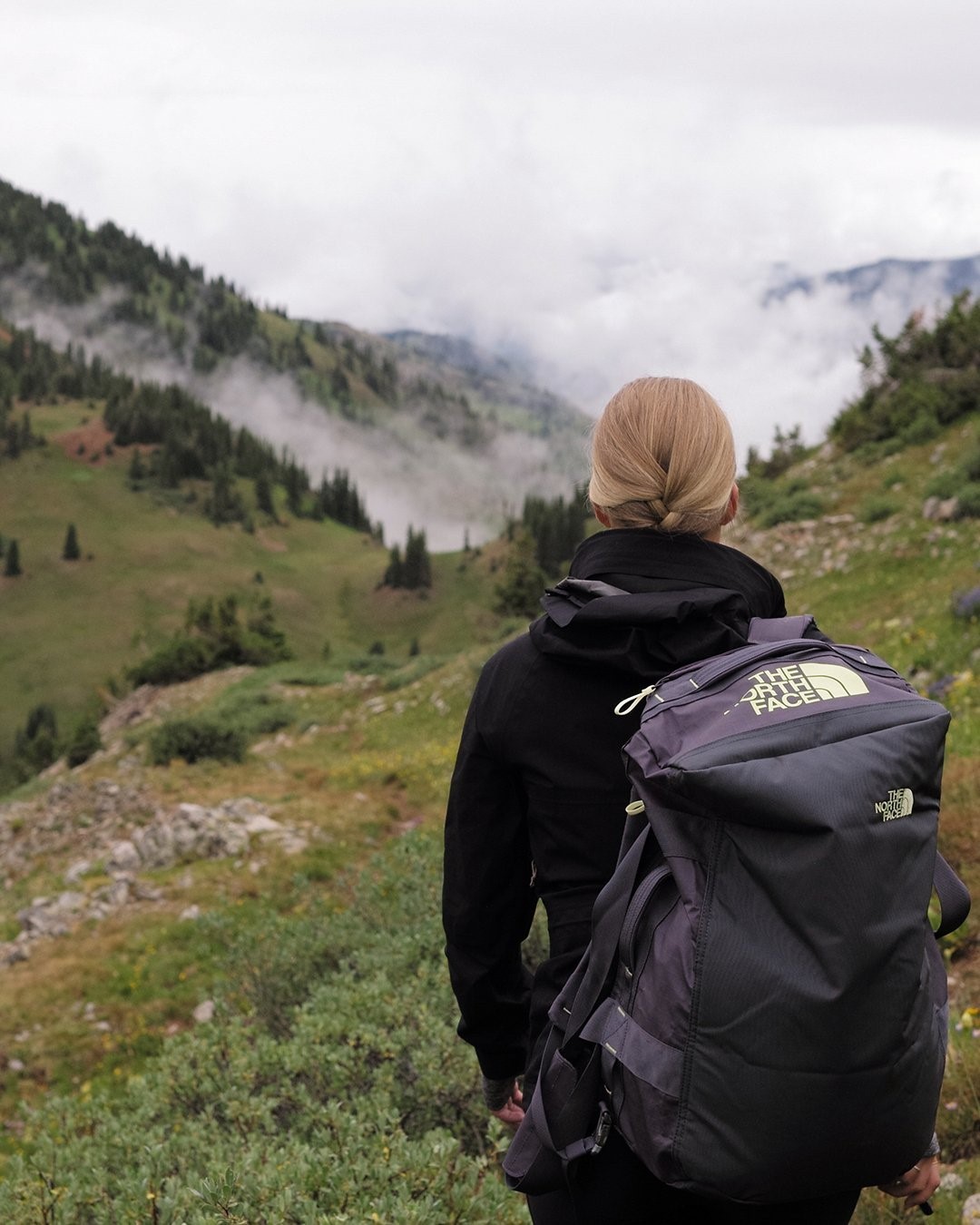 Woman Walking with a North Face Backpack. Photo by Instagram user @thenorthface