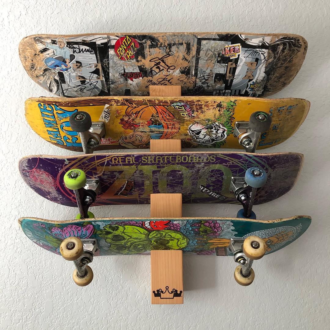 Four Skateboards on a Wall. Photo by Instagram user @3crowns_design