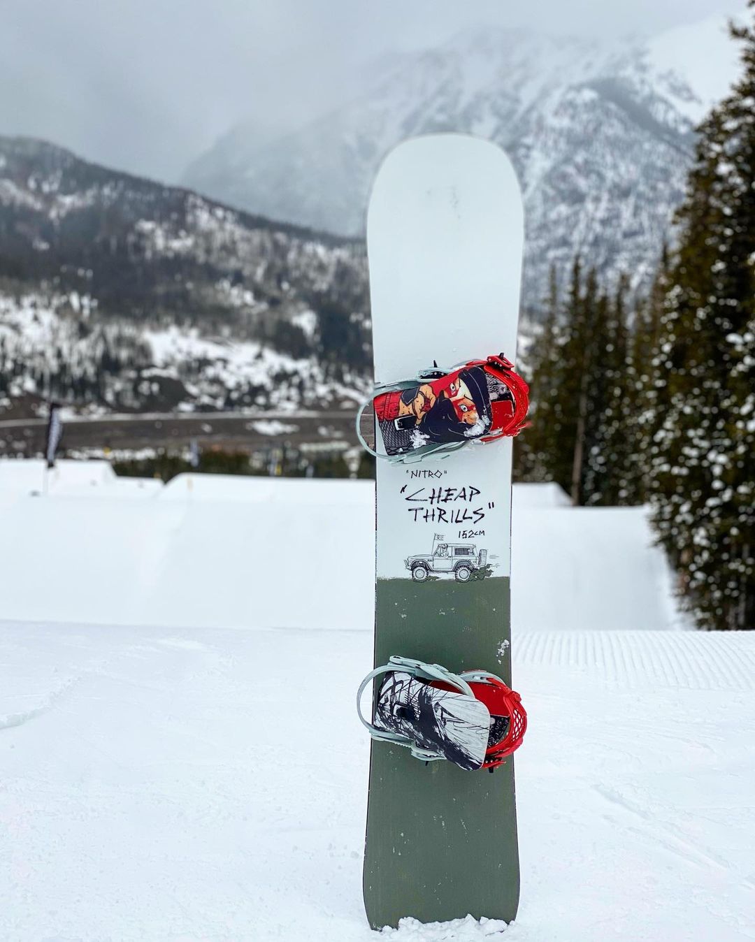 Snowboard Stuck Into the Snow. Photo by Instagram user @boardarchive