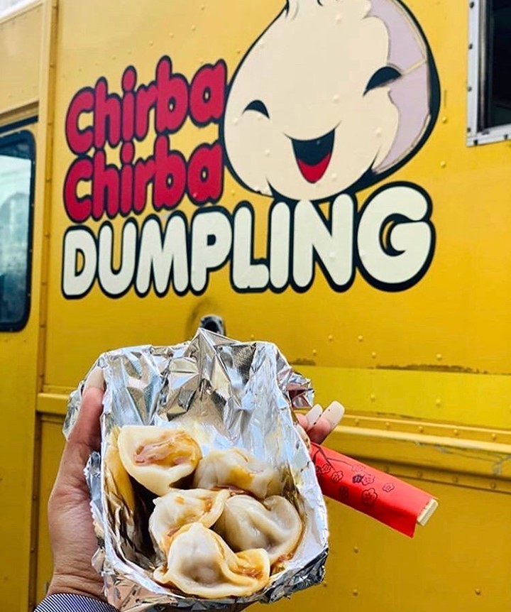 Person Holding Dumplings Outside of Chirba Chirba Dumpling Truck. Photo by Instagram user @chirbachirba