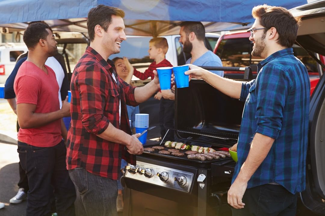 People Standing Around a Grill. Photo by Instagram user @lupientauto