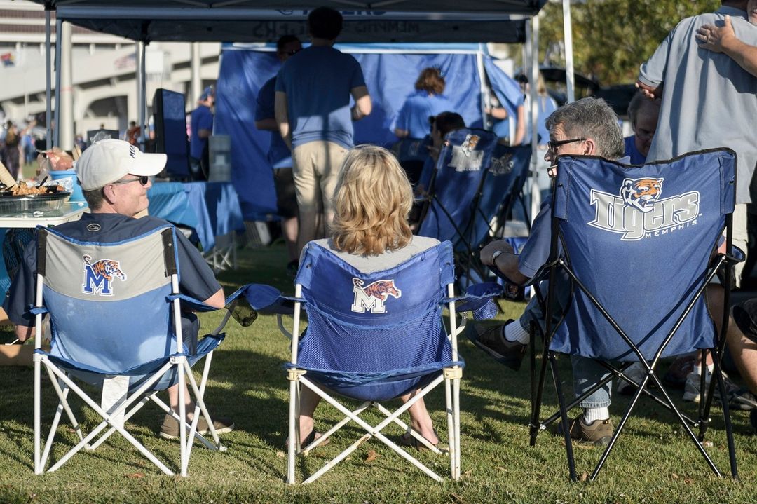 People Sitting in Chairs at a Tailgate. Photo by Instagram user @memphisalumni