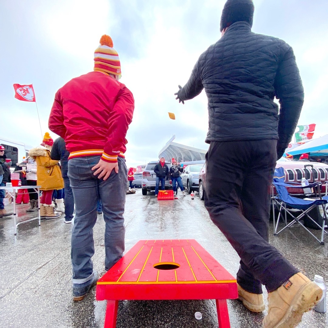 People Playing Cornhole Outside of a Football Stadium. Photo by Instagram user @frogyardgames