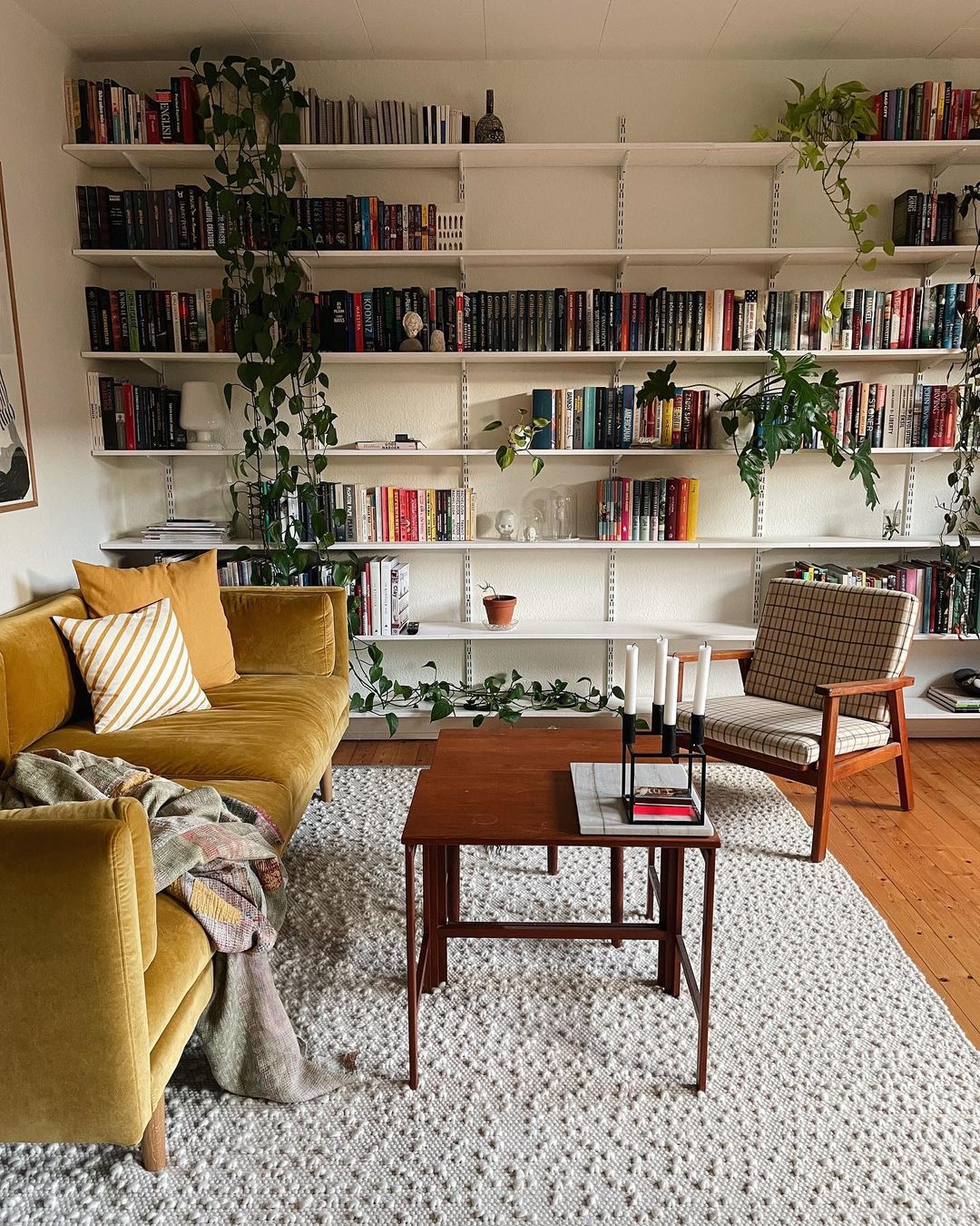 Modern Living Room with Large Library Wall. Photo by Instagram user @thildesecher